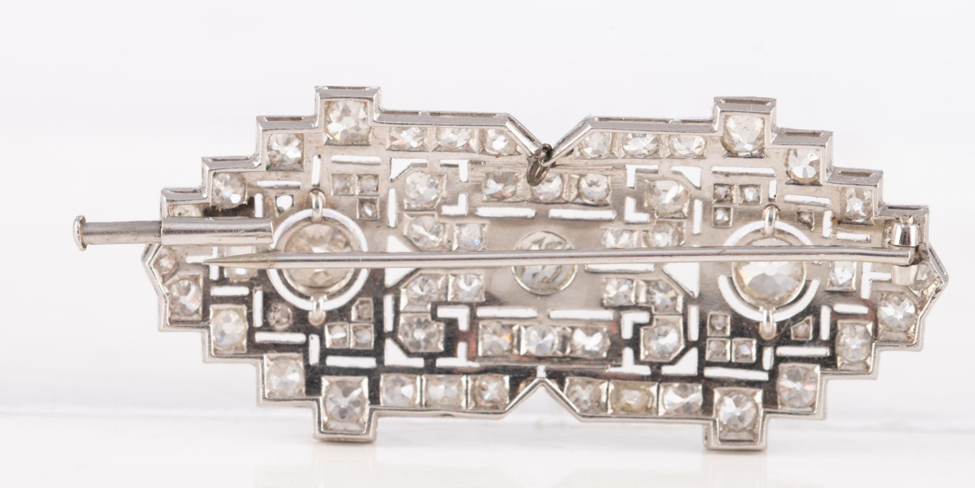 An 18ct white gold Art Deco style brooch set central with three bigger brilliant-cut diamonds and fu - Image 3 of 4