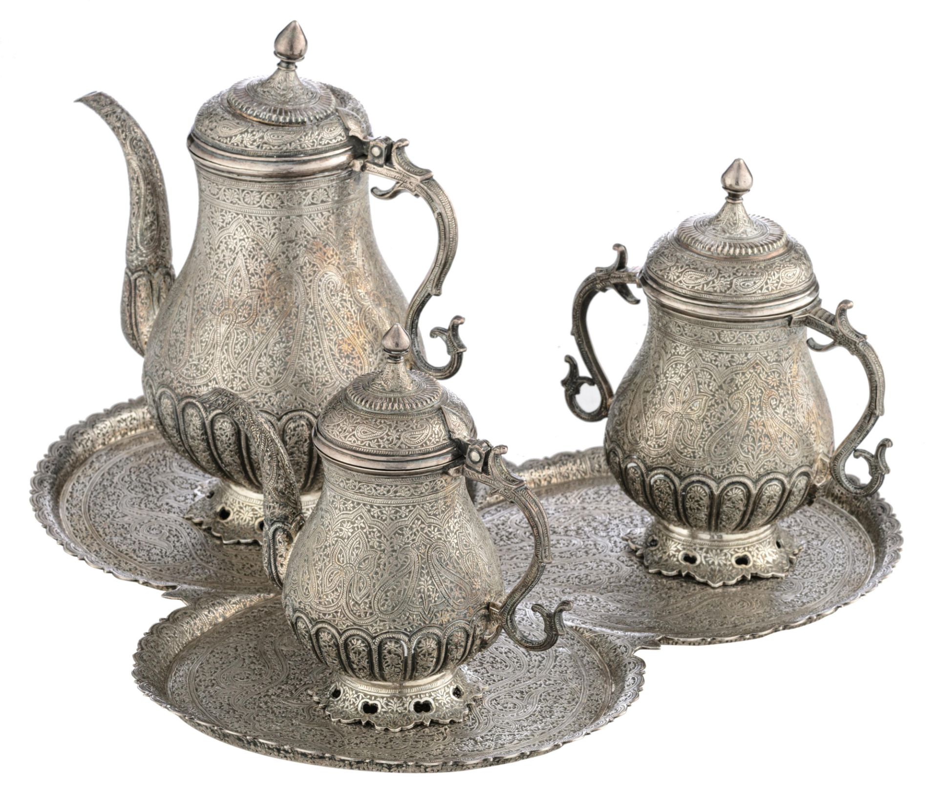 A Persian inspired horror vacui decorated tea set, no visible hallmarks but tested on silver purity,