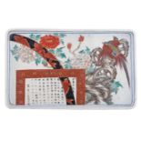 A Chinese blue and white floral decorated rectangular tray, iron-red decorated with a signed text wi