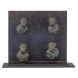 A collection of four ancient Roman bronze busts of Silenus figures, 1st – 2ndC AD, H 4,7 - 5 cm