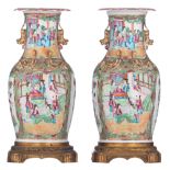 A pair of Chinese Canton vases, with fixed gilt bronze bottom mounts, 19thC, total H 41 cm