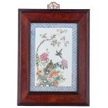 A Chinese famille rose porcelain plaque, in a hardwood frame, 28 x 41,5 cm (plaque)