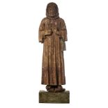 A 16th/17thC oak sculpture depicting a monk with a begging pouch, on a later base, H 121,5 cm (witho