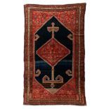 An Oriental woollen rug with stylized motifs, 19thC, 158 x 253 cm