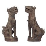 A pair of Chinese Yuan-Ming style bronze guardian lions, H 22,8 cm