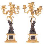 A fine pair of Neoclassical candelabras, decorated with putti, H 63,5