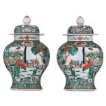 A pair of Chinese famille verte jars and covers, late 19thC, H 35 cm