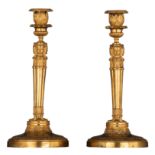 A pair of Empire style gilt bronze candlesticks, in the manner of Claude Galle, H 30,5 cm