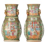 A pair of Canton vases, paired with gilt peach handles, 19thC, H 35,5 cm