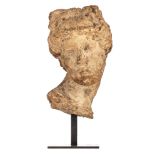 A classical limestone head of Aphrodite, possibly Roman period, H 36 cm