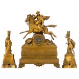 A French Charles X gilt bronze mantle clock, H 63; and two matching Historicism candlesitcks, H 40 c
