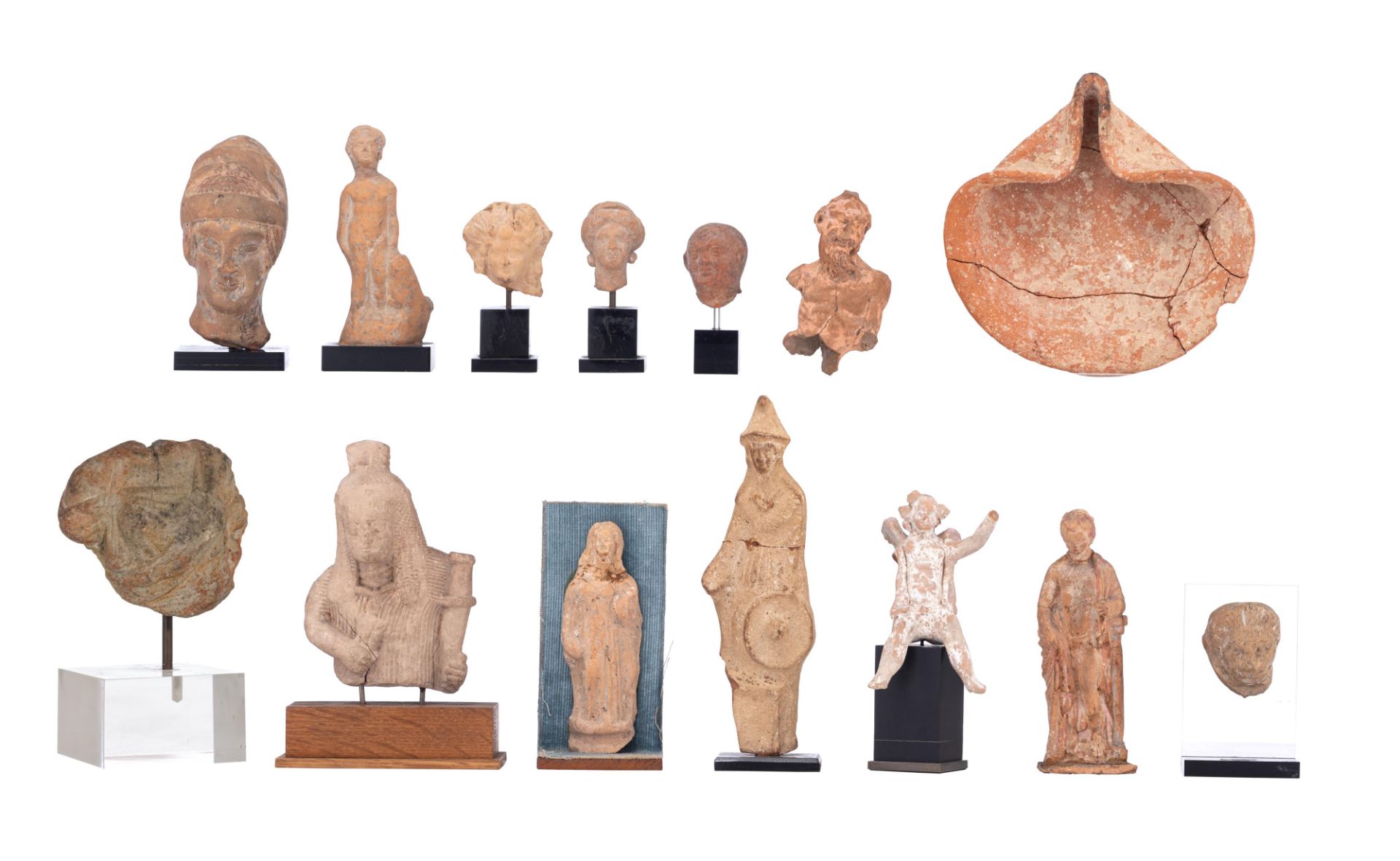 A collection of ancient sculpture fragments, stone and terracotta, 3rdC BC - 3rdC AD, 6,5 - 21,5 cm