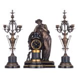 A fine Neoclassical three-piece clock garniture, with a patinated bronze antique beauty on top, H 56