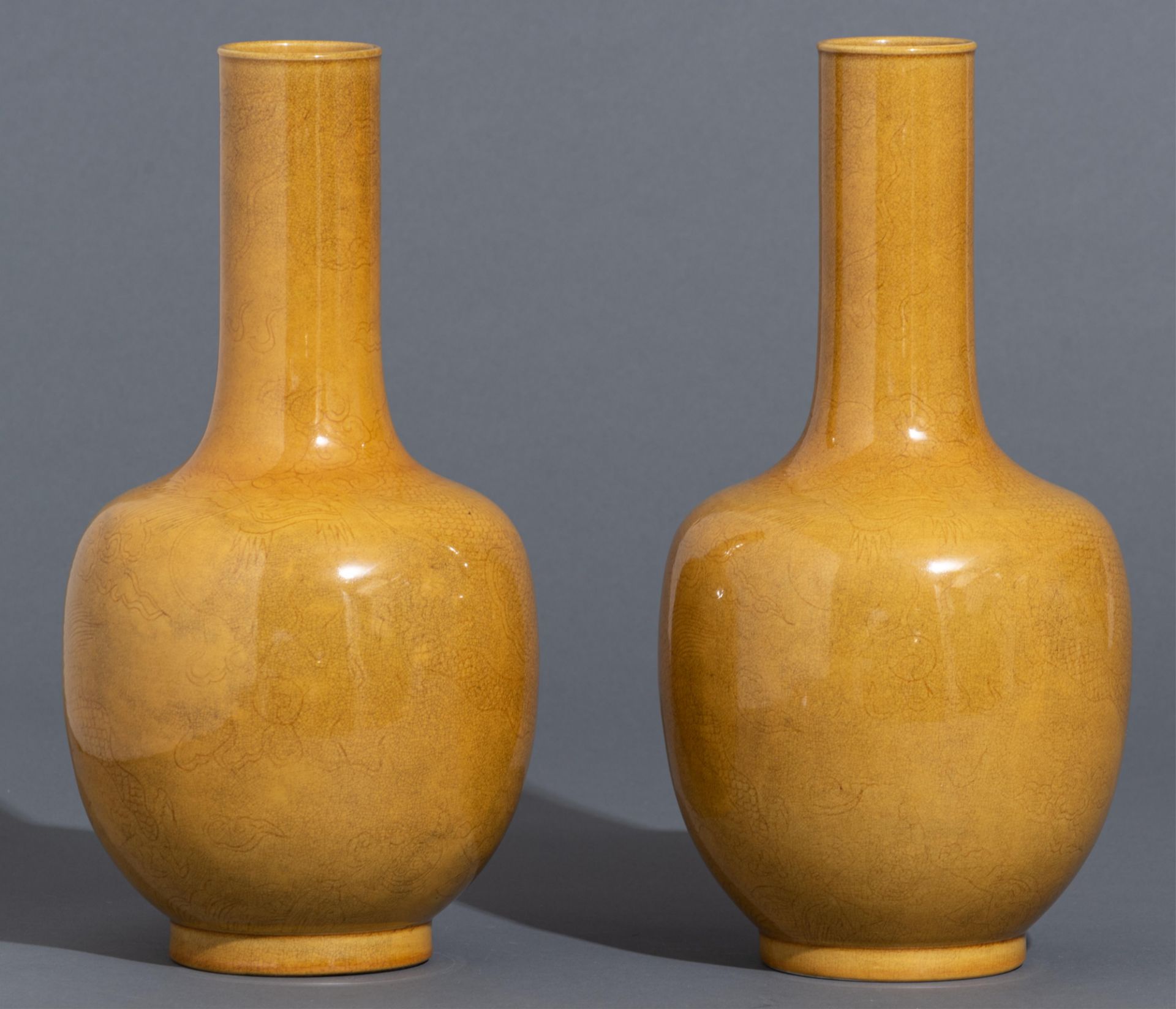 A pair of Chinese incised yellow-glazed 'Dragon' bottle vases, H 33,5 cm - Image 2 of 11