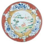 A Chinese iron-red and famille rose export porcelain plate, ø 35,5 cm
