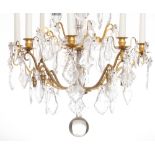 A gilt bronze and crystal cut chandlier, H 74,5 - ø 56 cm