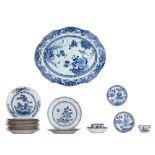 A collection of Chinese blue and white export porcelain plates, tea bowls and saucers, 18thC, larges