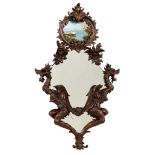 A Rococo style mirror, with on top an églomisé marine view, H 123 - W 75 cm