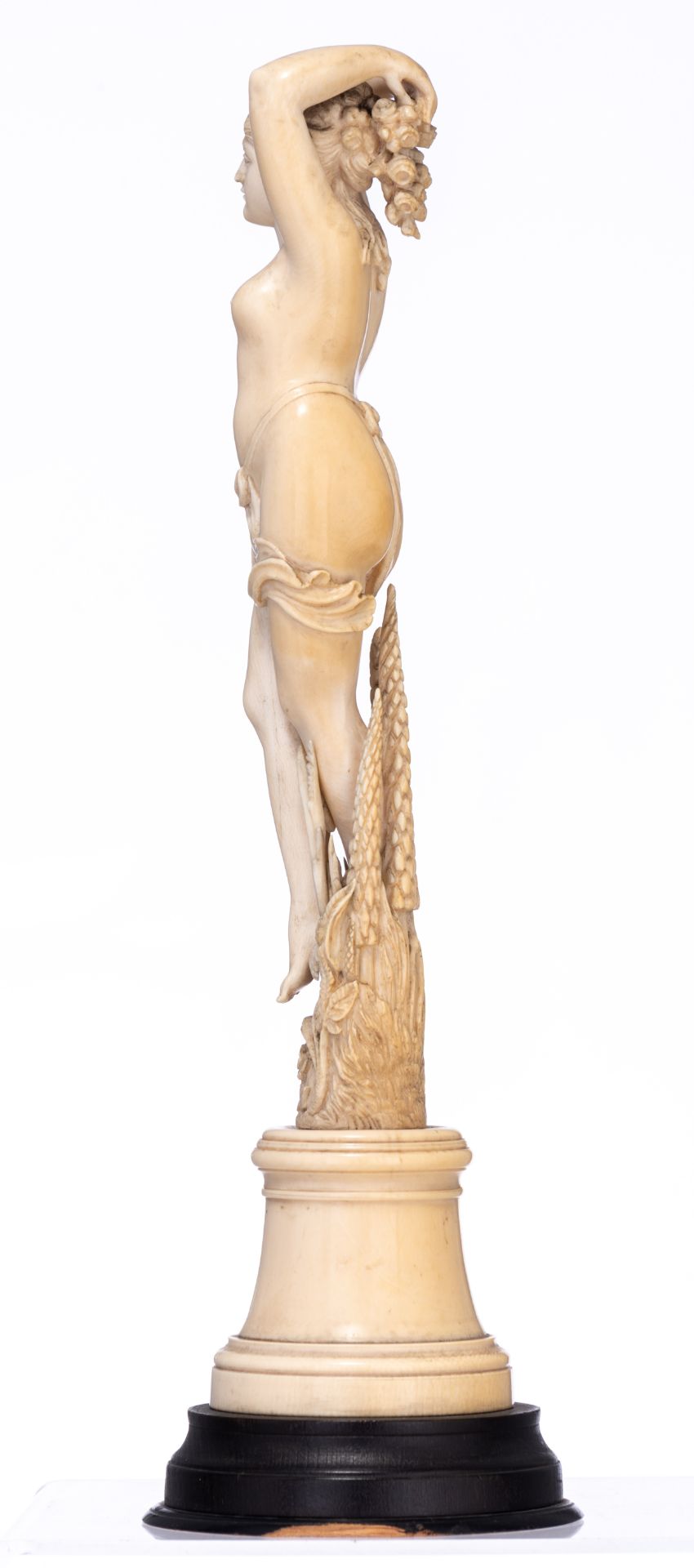 A 19thC Dieppe or Paris ivory standing female nude depicting Flora, H (wooden base incl.) 38,8 cm -