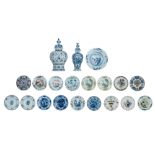 A large collection of Dutch Delftware dishes and vases, 18th-19thC, H 42,5 - 50 - ø 22,5 - 42,5 cm