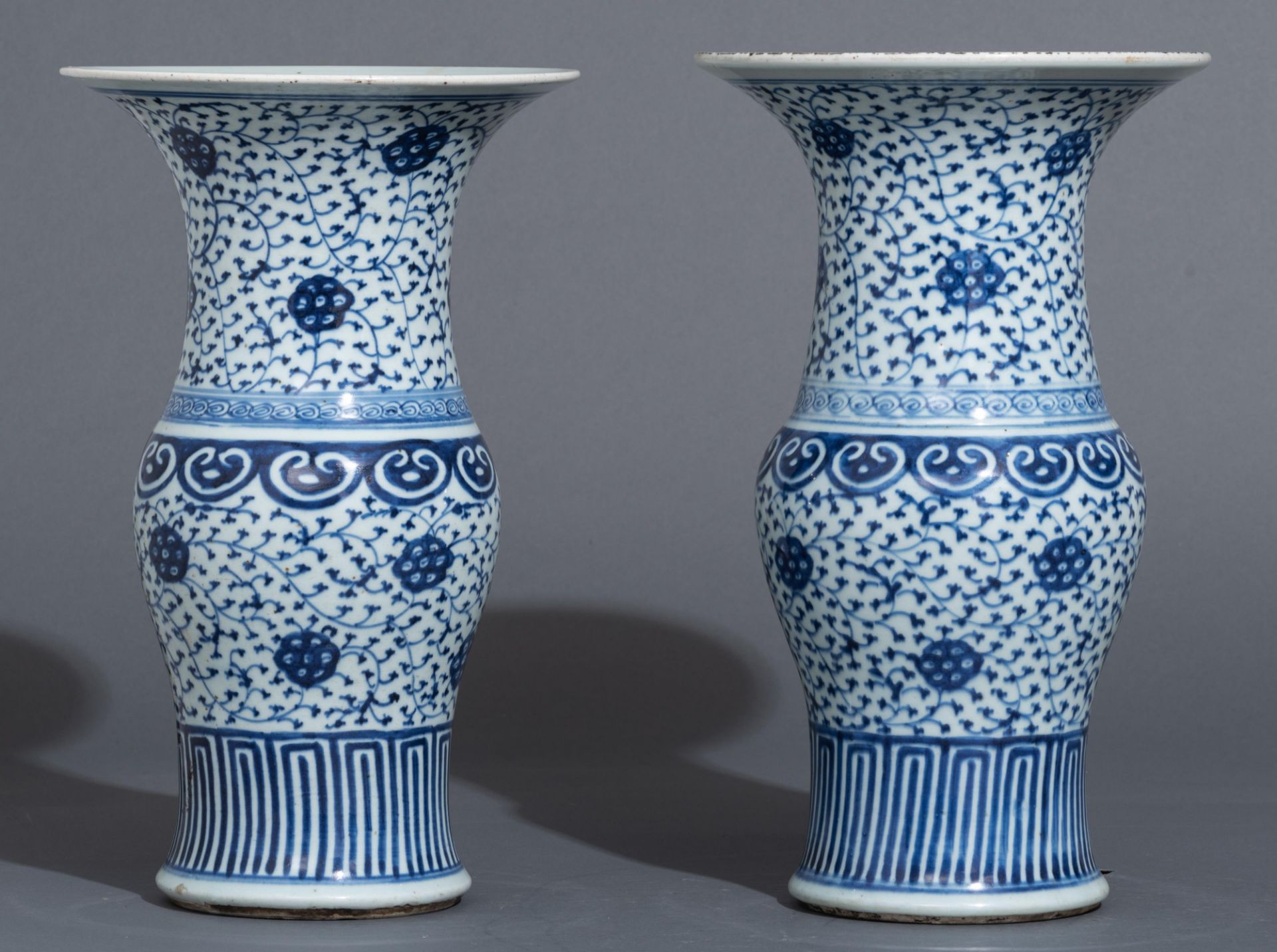 A pair of Chinese blue and white 'scrolling lotus' yenyen vases, 19thC, H 40 cm - Image 4 of 5