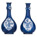 A pair of Chinese bleu poudré ground bottle vases, H 22,5 cm