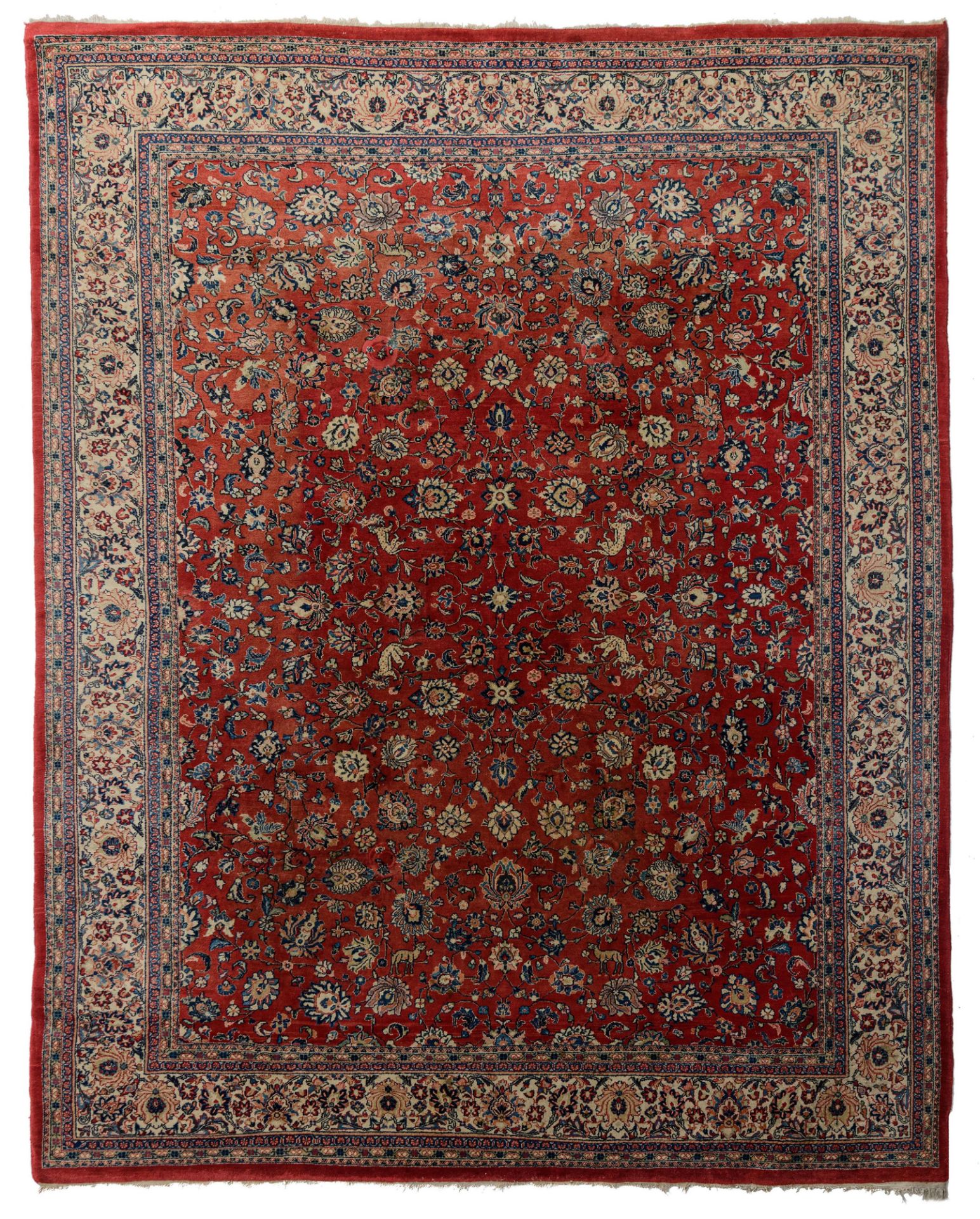A large Oriental Sarourg carpet, floral decorated with leopards and deers, 297 cm x 378 cm