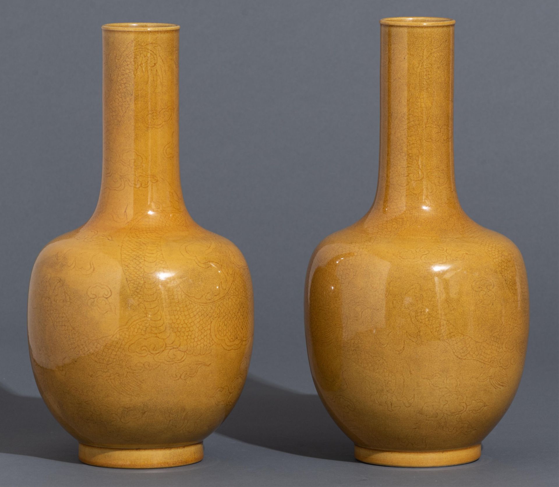 A pair of Chinese incised yellow-glazed 'Dragon' bottle vases, H 33,5 cm - Image 4 of 11
