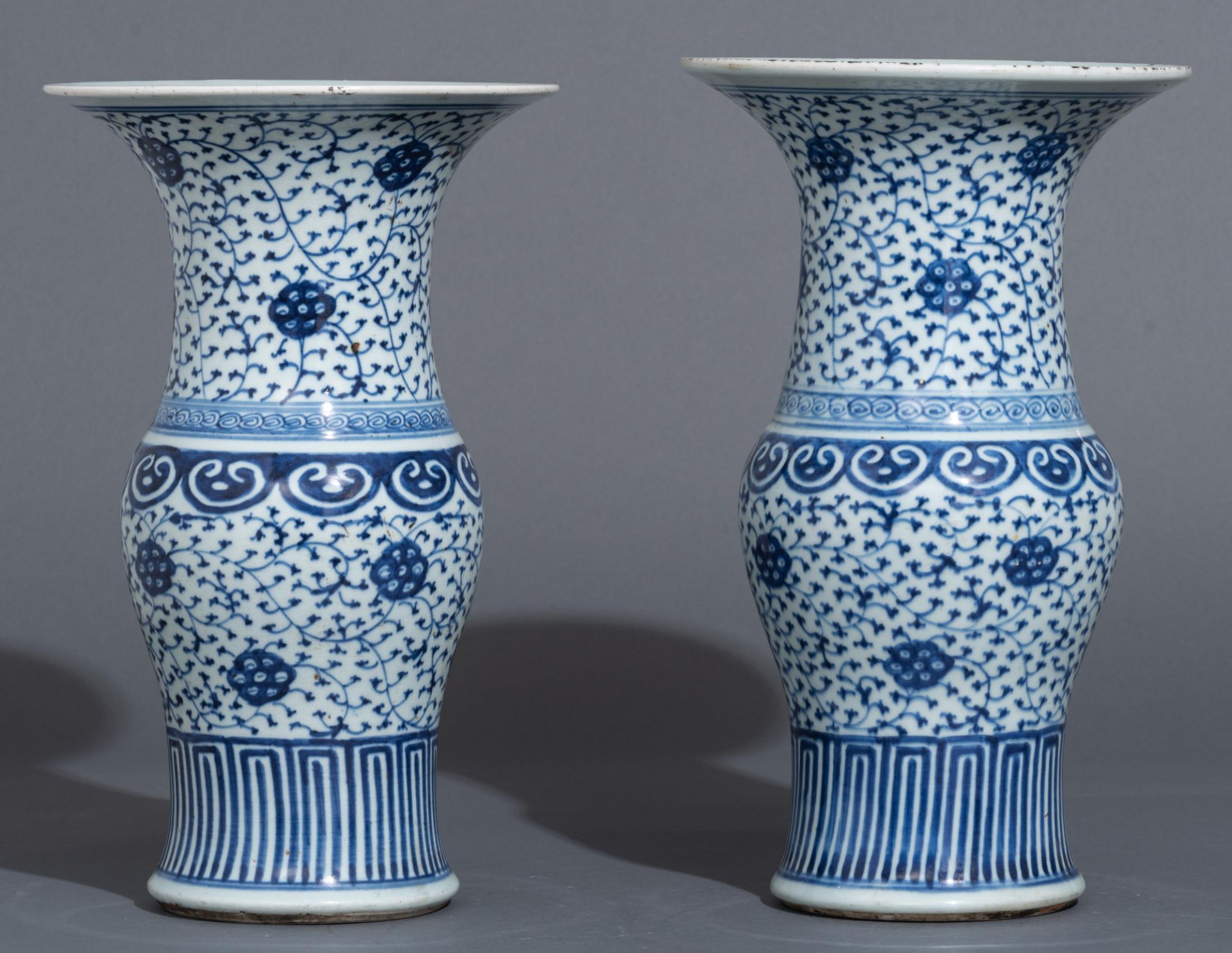 A pair of Chinese blue and white 'scrolling lotus' yenyen vases, 19thC, H 40 cm - Image 2 of 5