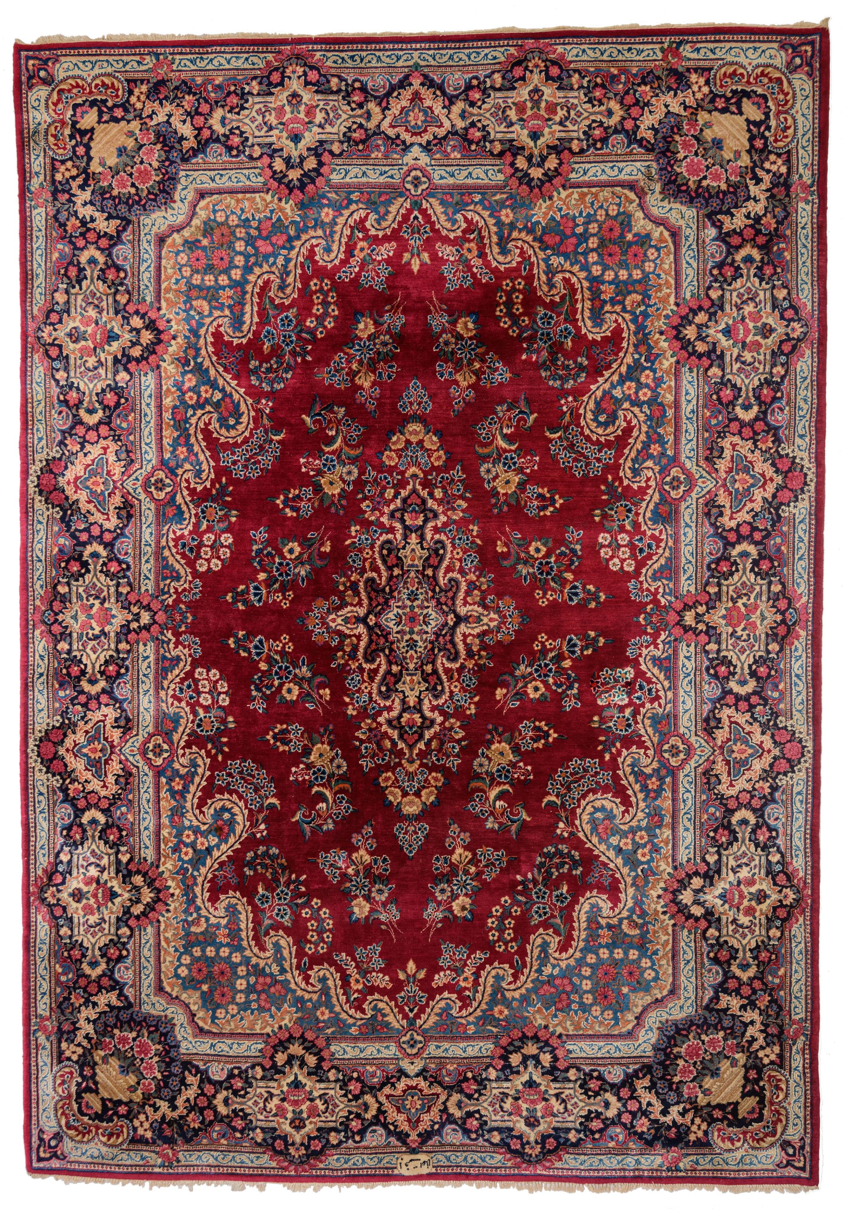 A large Oriental woollen rug, floral decorated, signed, 360 x 260 cm