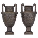 A pair of Neoclassical basso-relievo patinated bronze urns, H 39 cm