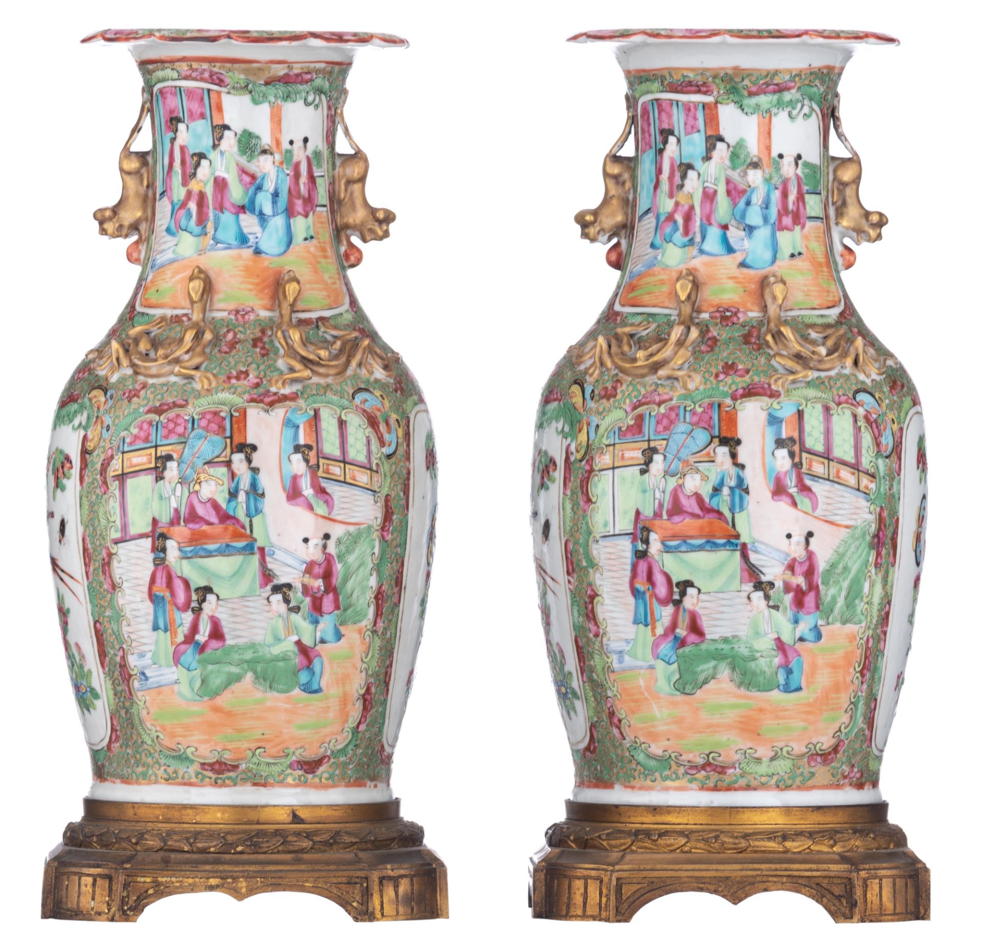 A pair of Chinese Canton vases, with fixed gilt bronze bottom mounts, 19thC, total H 41 cm