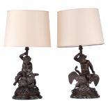 A pair of bronze putti taming a swan and an eagle, transformed into table lamps, H 44 - 73,5 cm