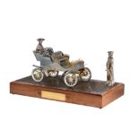 A scale reproduction of a '1903 Model A Ford', silver, gold, diamonds, and rubies, H 34 - W 62 - D 3