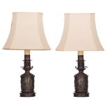 A pair of patinated bronze moderator lamps by Hadrot, H 31 - 72 cm