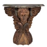 An Empire style console table, with a carved winged head, H 53 cm W 57 cm