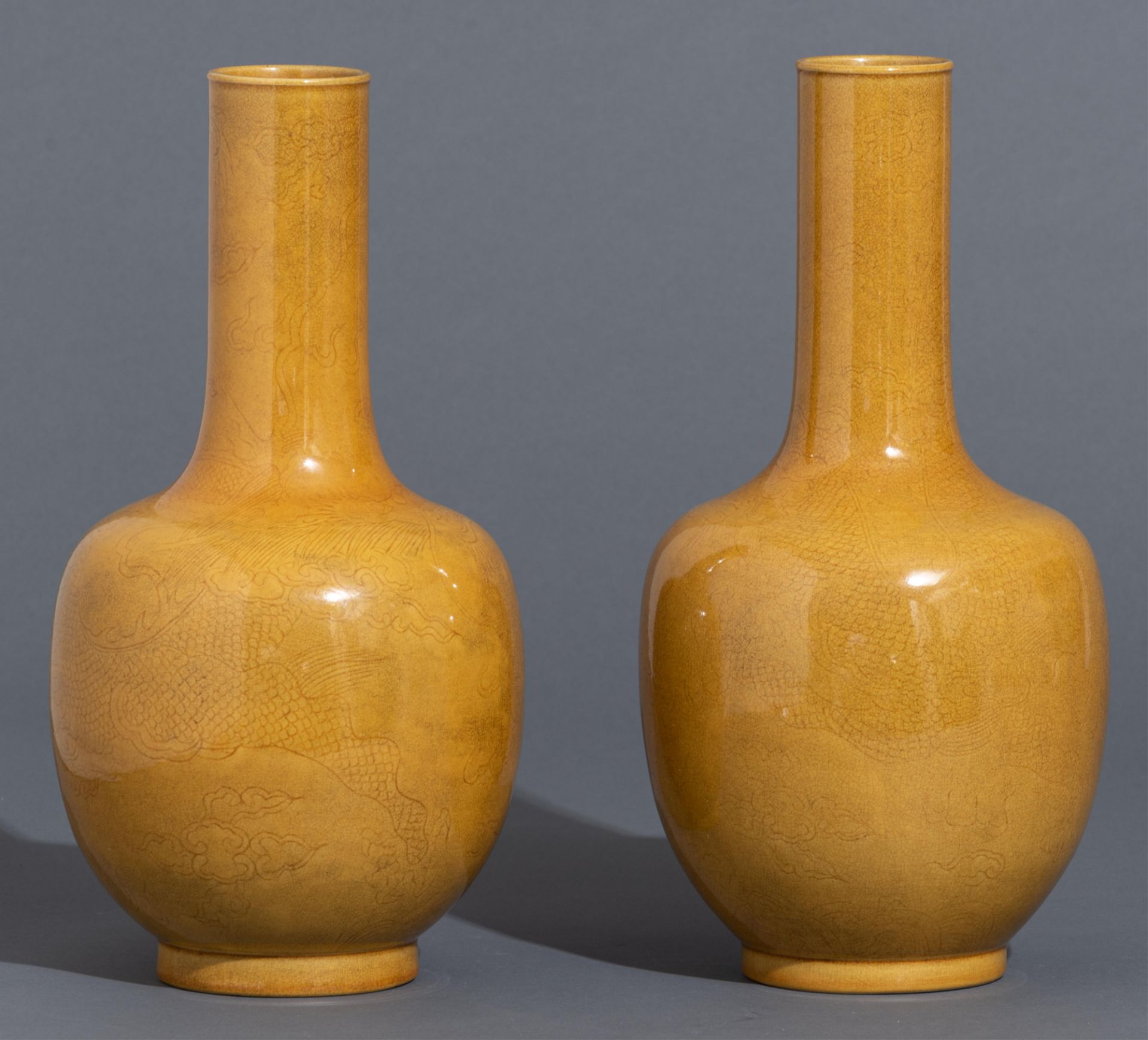 A pair of Chinese incised yellow-glazed 'Dragon' bottle vases, H 33,5 cm - Image 3 of 11