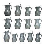 A collection of 13 various French and Flemish 18th and 19thC pewter covered jugs, H 18,3 - 25,2 cm