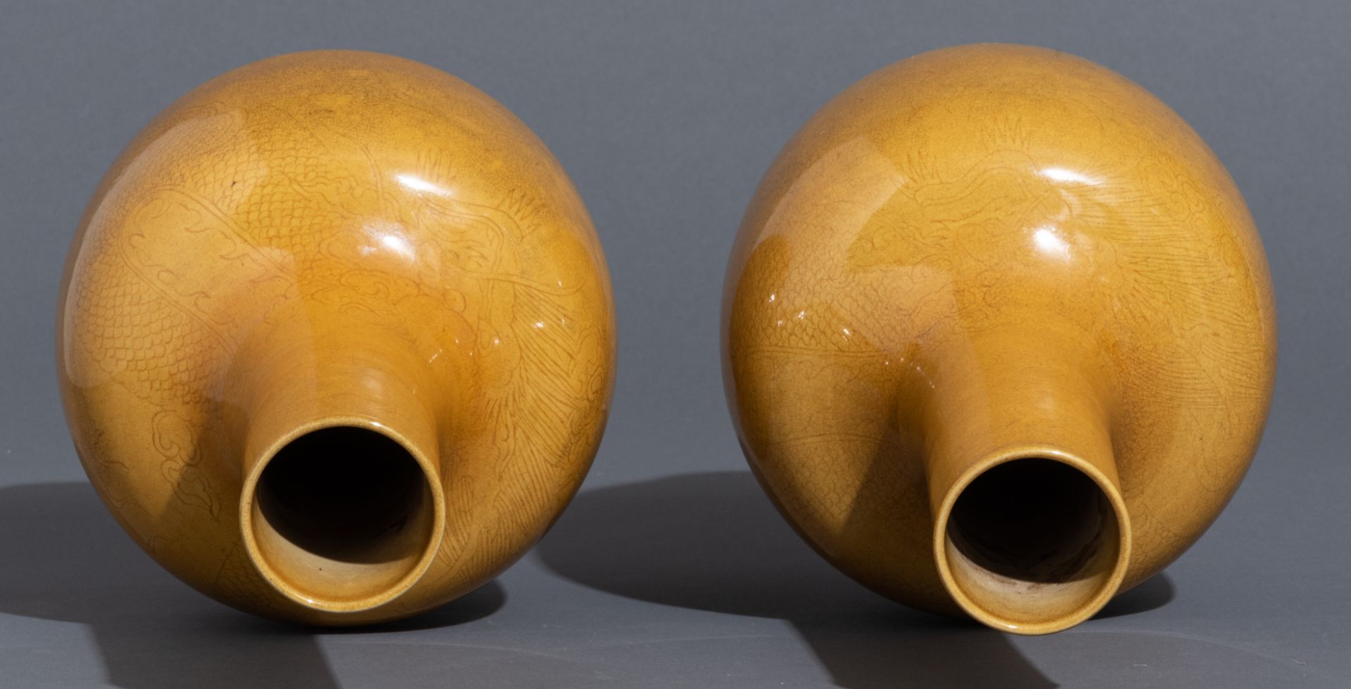 A pair of Chinese incised yellow-glazed 'Dragon' bottle vases, H 33,5 cm - Image 6 of 11