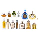 A varied collection of 12 factice perfume bottles, H 5 - 40 cm