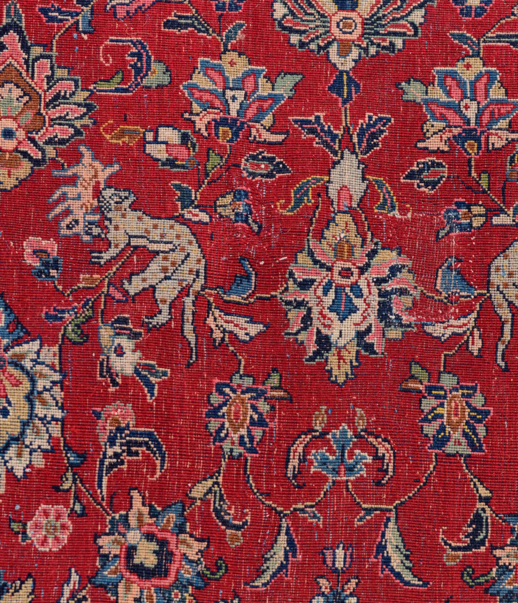 A large Oriental Sarourg carpet, floral decorated with leopards and deers, 297 cm x 378 cm - Image 6 of 7