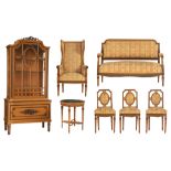 A Louis XVI style furniture set, containing a display cabinet, a round centre table, wall mirror, a