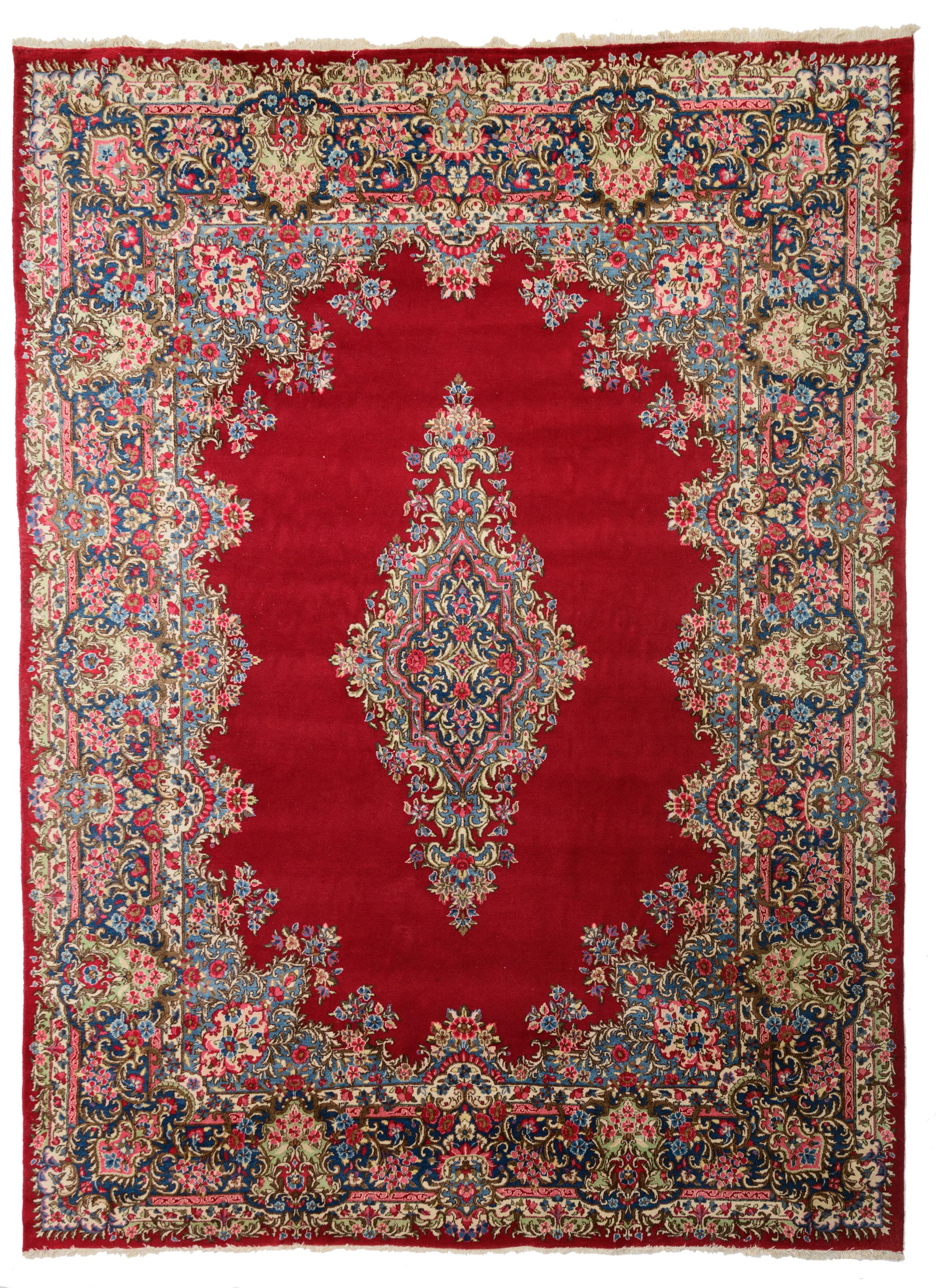 An Oriental Kirman rug, 296 x 395 cm