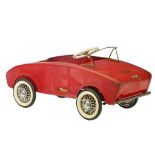 A Torck 'Cadet' (deluxe edition) red metal pedal car, made in 1959, 37,5 x 41 x 82,5 cm