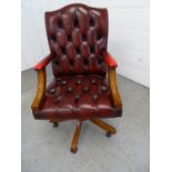 Leather Chair - a Sang de Beouf Leather buttonback , open arm, swivel office chair with 5 spoke base