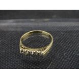 A continental Gold .833? 5 stone Diamond ring ,weighing 27.5 gms , size O 1/2