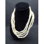 Freshwater pearls - two necklaces , one a three strand choker 16 1/2? / 42 cm long and a single