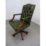 Leather Chair - a Green Leather buttonback , open arm, swivel office chair with 5 spoke base and
