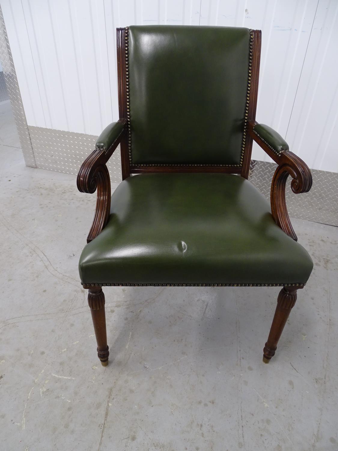 Leather open arm chair - a green leather over stuffed chair, with scroll ended arms, brass capped