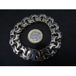 White metal bracelet- a 19 th C large and heavy flattened Curblink bracelet , unmarked but